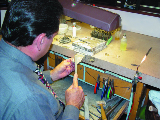 Jeweler sitting at the bench